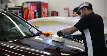 Customer Vehicle in the buffing and polishing process at dealer shop