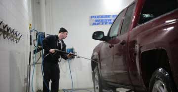 Customer Vehicle going through a complimentary service at dealer shop