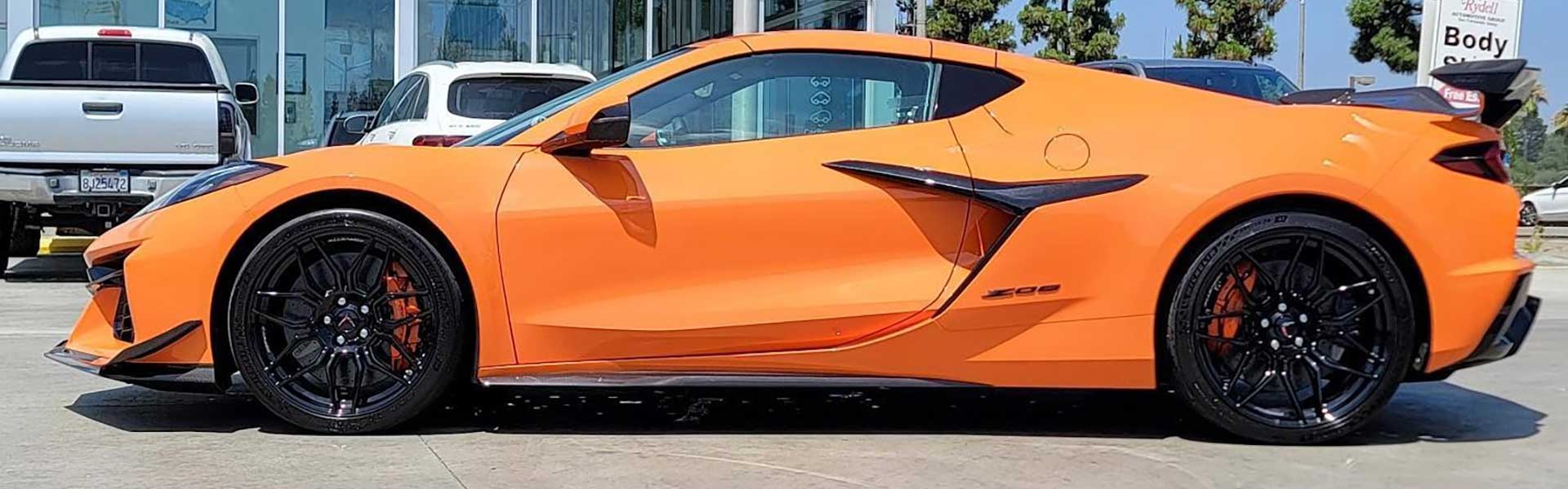 Orange and black Corvette Z06 parked infront of Rydell Chevrolet