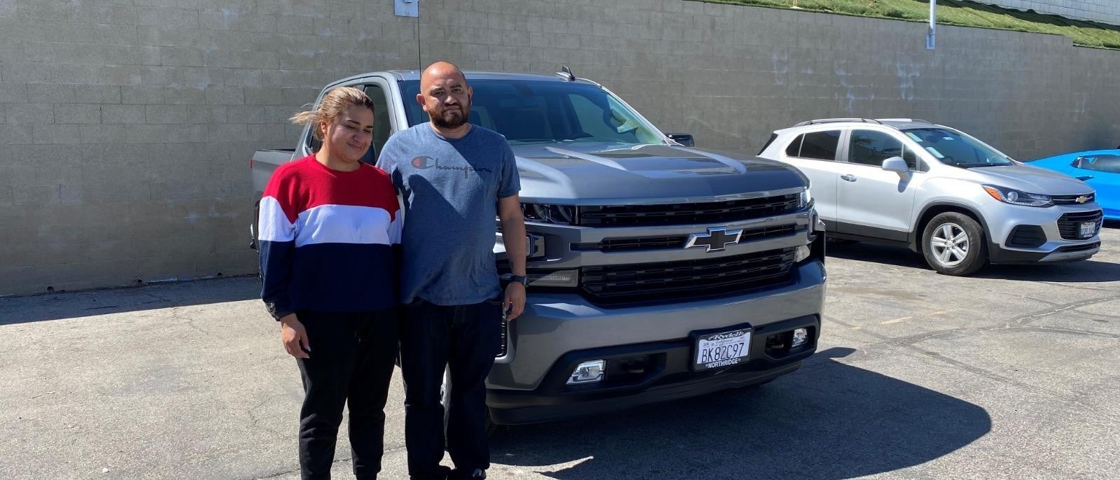 Two customers bought a silver Truck