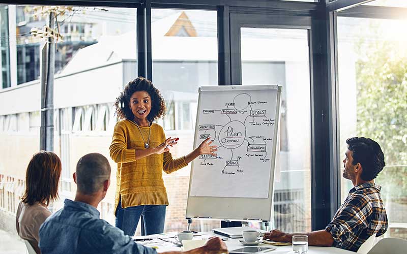 An employee leading discussion in training