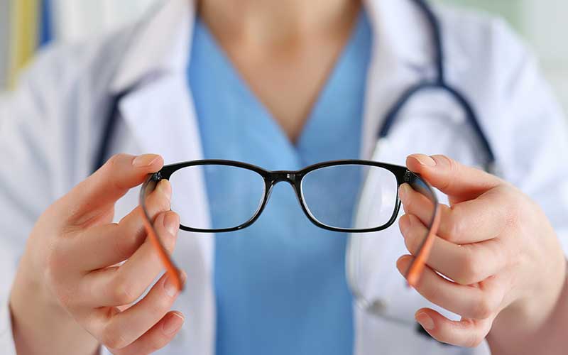 Eye doctor showing off glasses